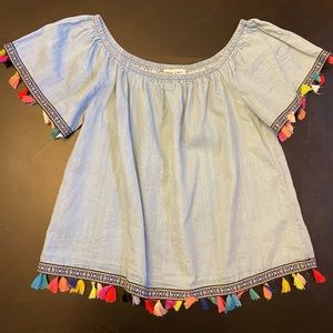 Speed limit off shoulder tassel blouse